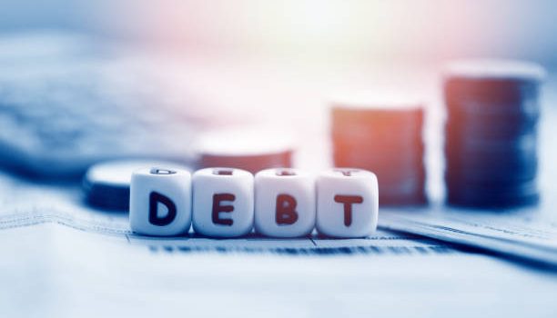 Debt credit card and money coin stack / Increased liabilities from exemption debt consolidation concept of financial crisis and problems risk business management loan interest